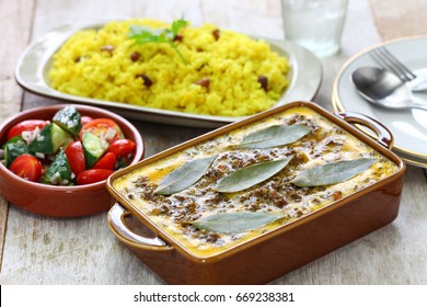 bobotie and yellow rice, south african cuisine.
bobotie is a curry flavored meatloaf with baked egg on top. - Powered by Shutterstock