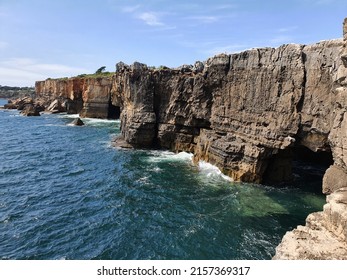 Boca Do Inferno, High Cliffs Feature A Natural Archway Or Open Cave, Created By Pounding Waves. 