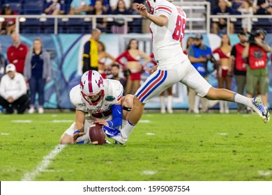 Boca Raton, Florida/USA - December 21, 2019: Florida Atlantic Owls Vs SMU Mustangs. Cheribundi Boca Raton Bowl 2019. College Football Players On The Field In Attack At FAU Football Stadium.