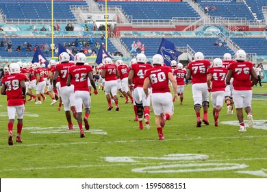 Boca Raton, Florida/USA - December 21, 2019: Florida Atlantic Owls Vs SMU Mustangs. Cheribundi Boca Raton Bowl 2019. College Football Players On The Field In Attack At FAU Football Stadium.