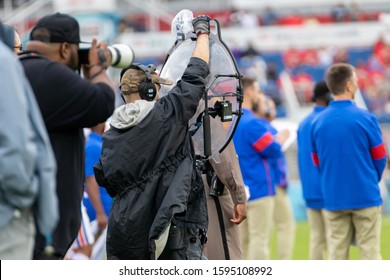 Boca Raton, Florida/USA - December 21, 2019: Florida Atlantic Owls Vs SMU Mustangs. Cheribundi Boca Raton Bowl 2019. College Football Team Staff.