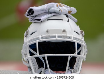 Boca Raton, Florida/USA - December 21, 2019: Florida Atlantic Owls Vs SMU Mustangs. Cheribundi Boca Raton Bowl 2019. White Football Helmet With White Football Gloves On Top