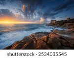 Boccale castle and the sandstone rocks of Romito during a storm at sunset. Livorno, Tuscany region, Italy, Europe