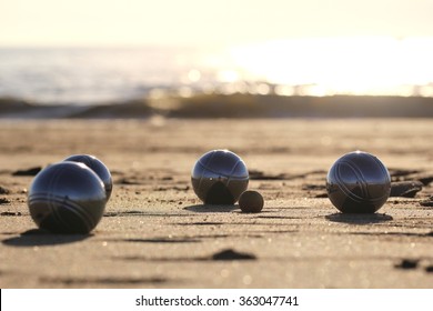 Bocce Balls On Sandy Beach