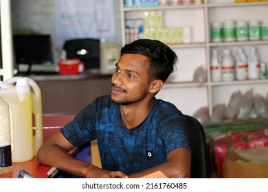 Boda, Bangladesh- April 26, 2022: A young boy is doing various photoshot style at business shop.