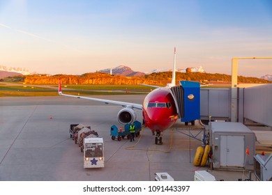 BODO, NORWAY - JUNE 2018: Norwegian Air Airplane At Terminal Gate,  During Stop At Bodo, Norway.
Bodo Airport, Midnight Sun Season.