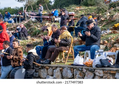 Bodrum, Mugla, Turkey, 01.08.2022: Muslim Men Praying At The Opening Of The Traditional Camel Wrestling Festival. People Gather For Picnic, Watching The Event Outside Of The Open Air Sports Arena  