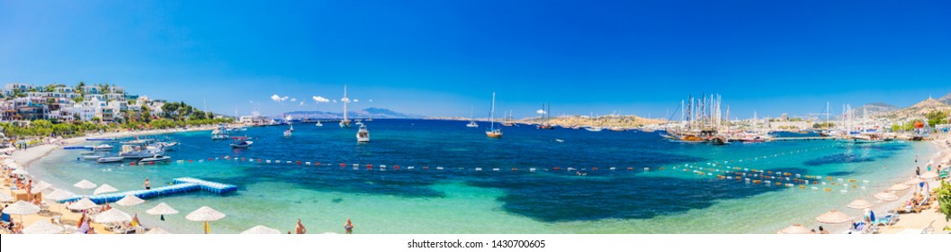 Bodrum, Mugla / Turkey - 05/24/ 2019 : Panoramic View of Bodrum Beach, Aegean sea, traditional white houses, marina, sailing boats, yachts in Bodrum town Turkey. 