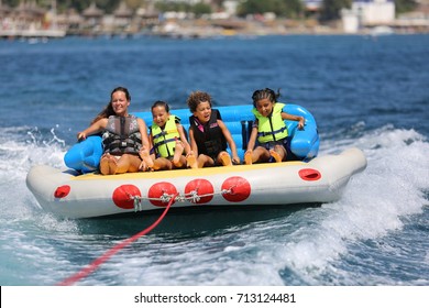 Bodrum - Turkey - August 25, 2017 : Happy Family Having Fun By Doing Watersports In Bodrum -Turkey