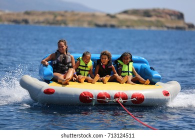 Bodrum - Turkey - August 25, 2017 : Happy Family Having Fun By Doing Watersports In Bodrum -Turkey