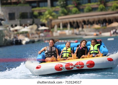 Bodrum - Turkey - August 25, 2017 : Happy Family Having Fun By Doing Watersports In Bodrum -Turkey