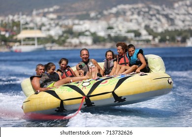 Bodrum - Turkey - August 25, 2017 : Happy Family Having Fun By Doing Watersports In Bodrum -Turkey