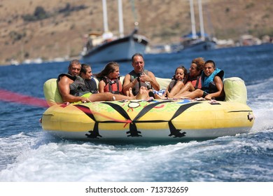 Bodrum - Turkey - August 25, 2017 : Happy Family Having Fun By Doing Watersports In Bodrum -Turkey