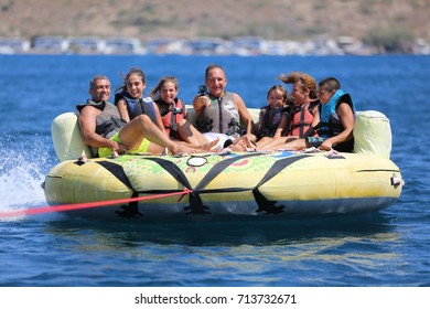 Bodrum - Turkey - August 25, 2017 : Happy Family Having Fun By Doing Watersports In Bodrum -Turkey