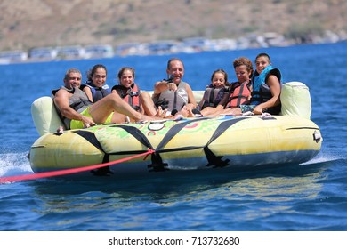 Bodrum - Turkey - August 25, 2017 : Happy Family Having Fun By Doing Watersports In Bodrum -Turkey