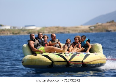 Bodrum - Turkey - August 25, 2017 : Happy Family Having Fun By Doing Watersports In Bodrum -Turkey