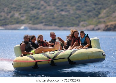 Bodrum - Turkey - August 25, 2017 : Happy Family Having Fun By Doing Watersports In Bodrum -Turkey