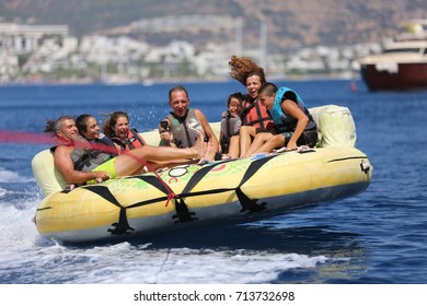 Bodrum - Turkey - August 25, 2017 : Happy Family Having Fun By Doing Watersports In Bodrum -Turkey