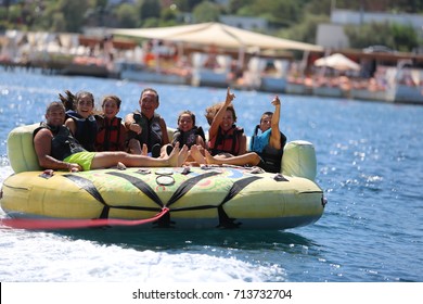 Bodrum - Turkey - August 25, 2017 : Happy Family Having Fun By Doing Watersports In Bodrum -Turkey