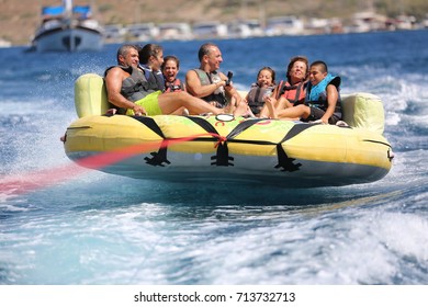 Bodrum - Turkey - August 25, 2017 : Happy Family Having Fun By Doing Watersports In Bodrum -Turkey