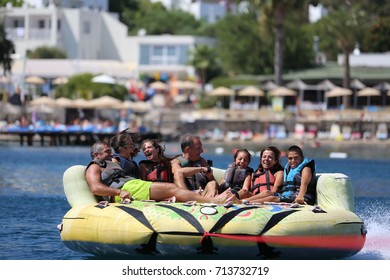 Bodrum - Turkey - August 25, 2017 : Happy Family Having Fun By Doing Watersports In Bodrum -Turkey