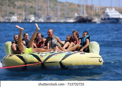 Bodrum - Turkey - August 25, 2017 : Happy Family Having Fun By Doing Watersports In Bodrum -Turkey