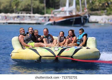 Bodrum - Turkey - August 25, 2017 : Happy Family Having Fun By Doing Watersports In Bodrum -Turkey