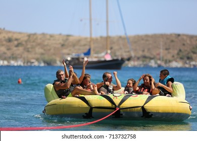 Bodrum - Turkey - August 25, 2017 : Happy Family Having Fun By Doing Watersports In Bodrum -Turkey