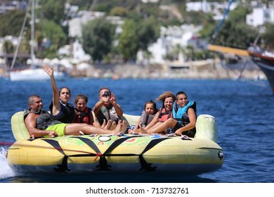 Bodrum - Turkey - August 25, 2017 : Happy Family Having Fun By Doing Watersports In Bodrum -Turkey