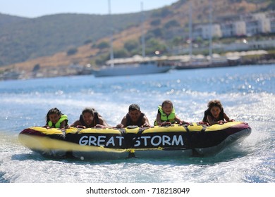 Bodrum - Turkey - August 25, 2017 : Happy Family Having Fun By Doing Watersports In Bodrum -Turkey