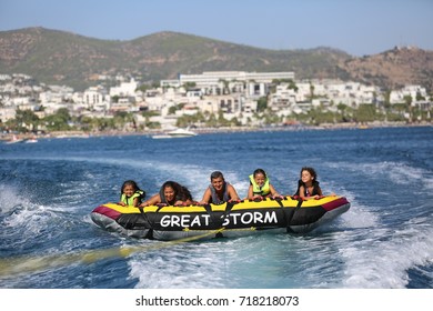 Bodrum - Turkey - August 25, 2017 : Happy Family Having Fun By Doing Watersports In Bodrum -Turkey