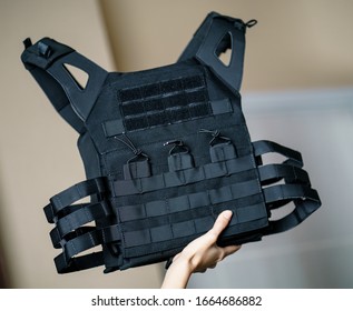 Body armor suit, Bulletproof vest for protection from bullets in the hand.