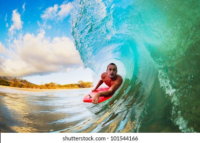 Body Boarder On Large Wave Surfing In The Tube Getting Barreled