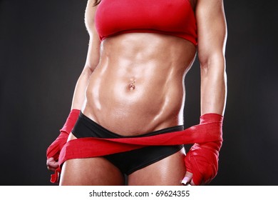 Body builder with boxing wraps