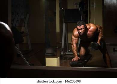 Body Builder Doing Heavy Weight Exercise For Back