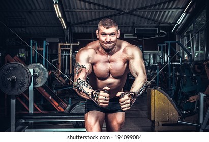 Body Builder Working Out At Gym 