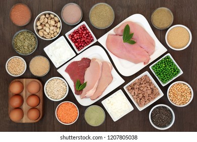 Body Building Health Food With High Protein Lean Chicken, Steak And Pork Meat, Dairy, Supplement Powders, Legumes, Nuts, Seeds, Cereals, Grain, Ginkgo Tea, Vegetables And Fruit. Top View On Oak Wood.