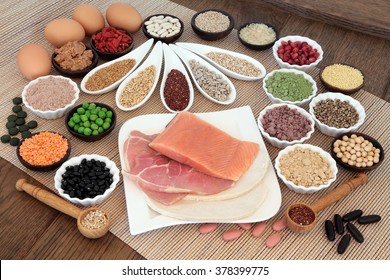 Body Building Health And Super Food With High Protein Meat, Fish, Eggs, Pulses, Seeds, Nuts, Grains, Supplement Powders, Vitamin Tablets And Fruit.
 