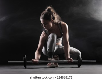 Body Building: Young Woman Lifting Weights