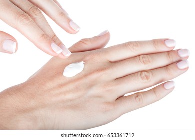 Body Care. Applying Hand Moisturiser Cream On Female Hands, Closeup Isolated On White