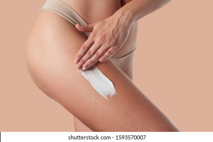 Body Care. Woman Applying Cream On Legs. Female Applying Anti Cellulite Cream