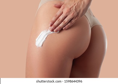 Body Care. Woman Applying Cream On Legs And Buttocks. Female Applying Anti Cellulite Cream