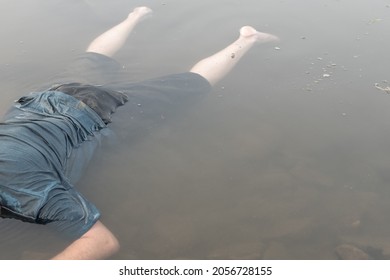 The Body Of A Dead Man Drowned In The River , Killed In The Water , A Bluish Corpse. Selective Focus, Cinematic Photo Toning