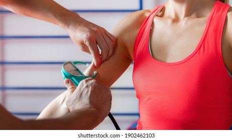 Body Fat Skinfold Test For Adults, Using Caliper On An Upper Arm, Over Biceps Muscle 