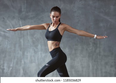 Body Fitness. Woman Training In Fashion Black Sportswear - Powered by Shutterstock