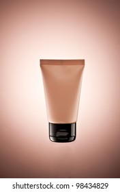 body lotion tube over color gradiented background