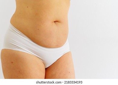 Body Of Middle-aged Woman With Fat Saggy Belly, Lack Of Abdominal Muscles, Concept Of Fitness, Skin Tightening, Healthy Eating, Fast Food