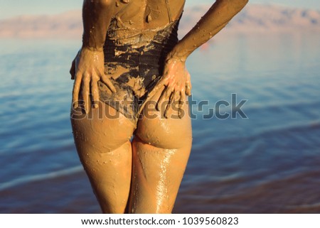 Similar – Anonymous woman applying sunscreen by the poolside