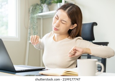 Body muscles stiff problem, ache asian young woman, girl pain back, stretch while sitting work on chair at home, holding massaging rubbing, hurt or sore, Healthcare people, office syndrome . - Shutterstock ID 2199177747