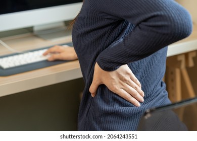 Body Muscles Stiff Problem, Asian Young Attractive Woman, Girl Pain With Back Pain Ache From Computer Work, Holding Massaging Rubbing, Hurt Or Sore While Sitting On Chair At Home. Healthcare People.